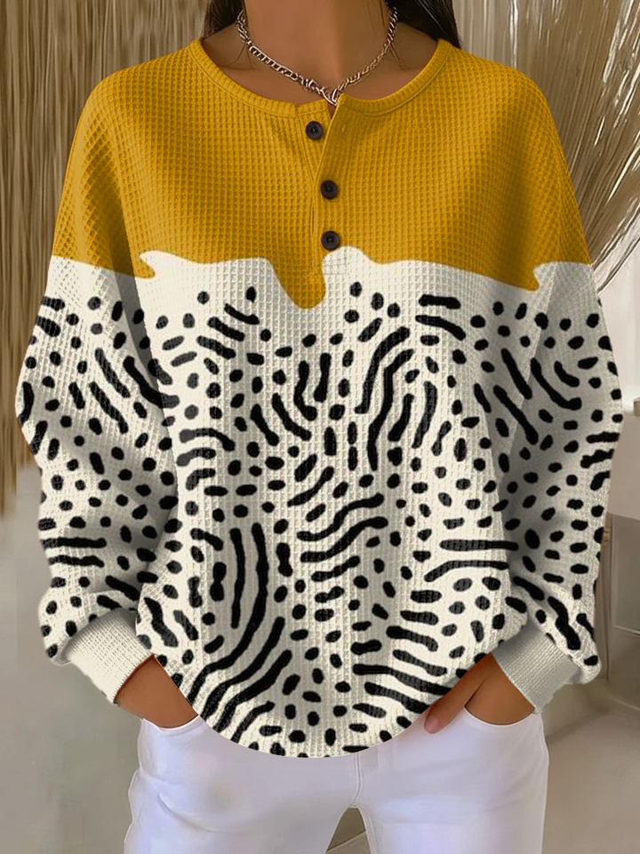Waffle knit henley with mustard yellow yoke and cream lower body covered in black dot and squiggle print 13