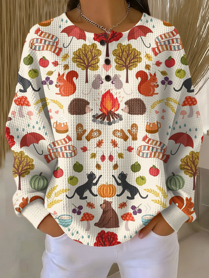 Cream waffle knit henley printed with autumn animals, campfire, pumpkins, mushrooms, umbrellas and scarves 19