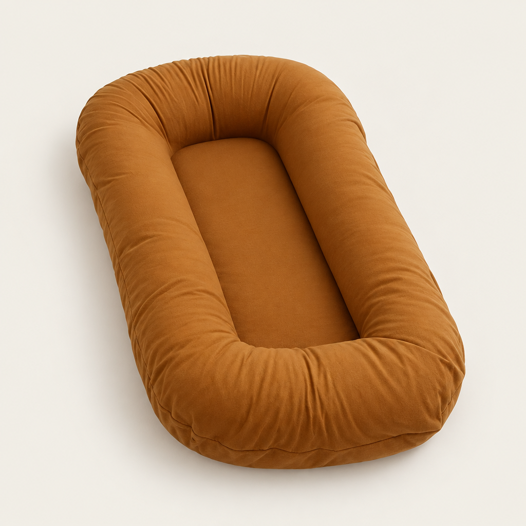 Empty caramel brown support pillow with a thick rounded rim, photographed at an angle on a light background 9