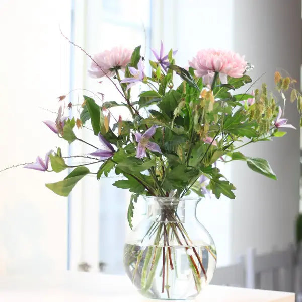 Another view of flowers arranged in a clear glass vase