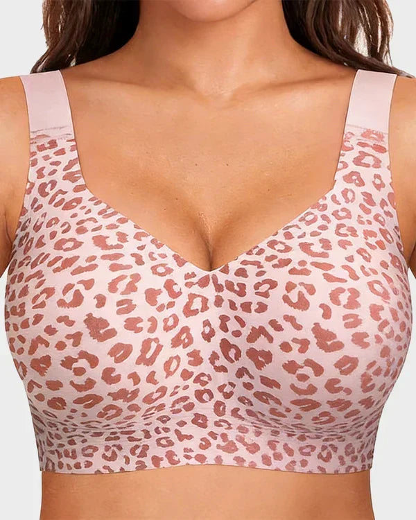 Close-up front view of the wireless bra in a pink and rose leopard print with wide shoulder straps. 1