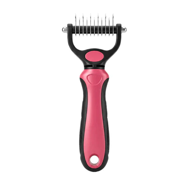 Pink and black grooming rake seen from the front on a white background 12