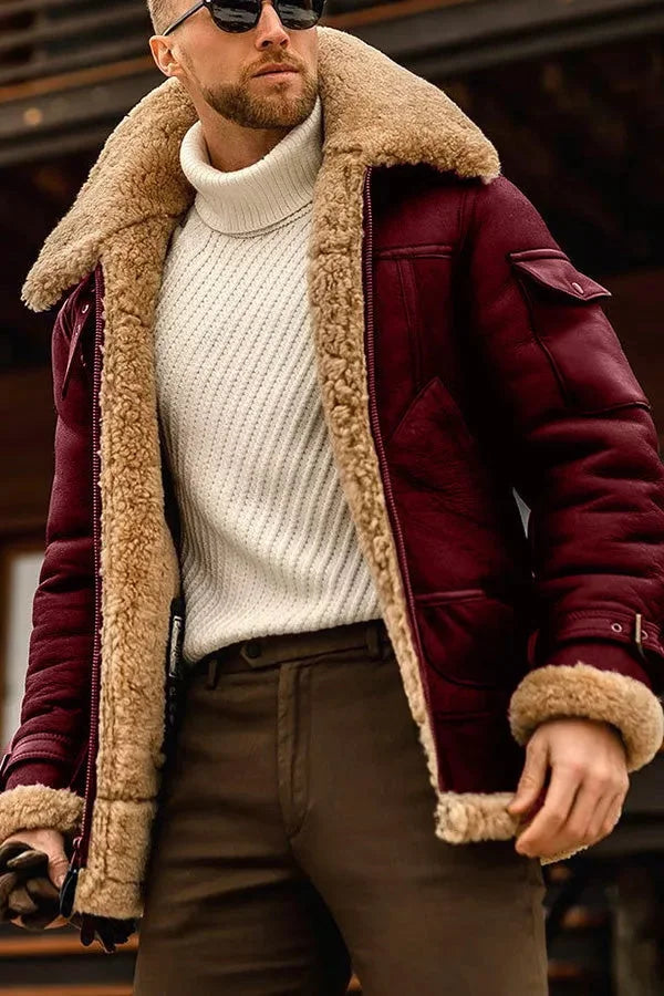 Close-up of the jacket in burgundy leather with tan shearling lining, worn over a cream ribbed turtleneck 4