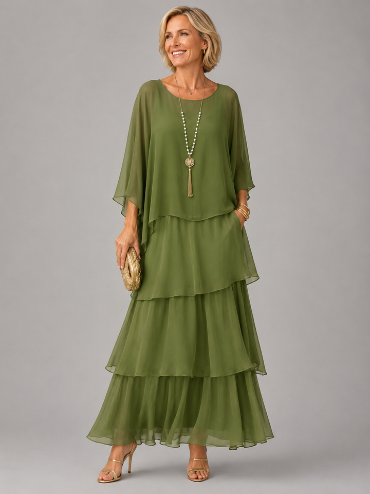 Green tiered chiffon maxi dress with a flowing cape top