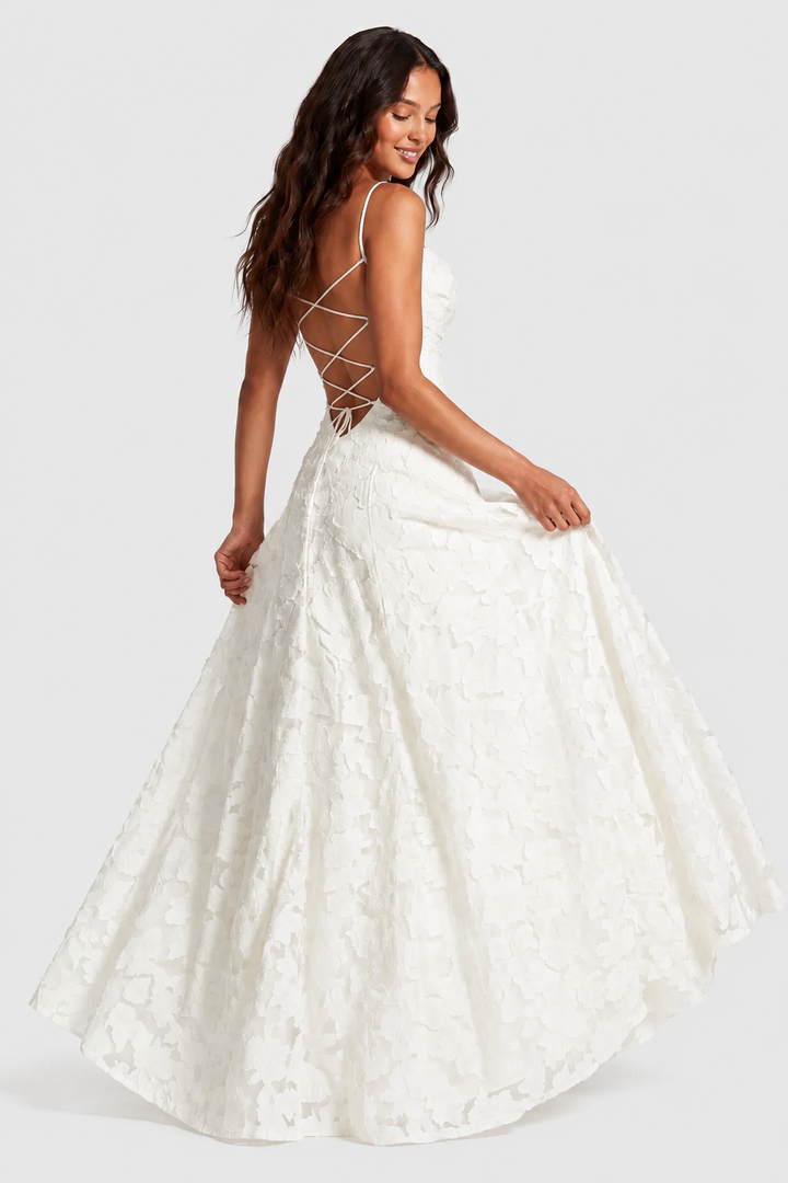 Ivory floral lace dress with a criss-cross lace-up back and swirling skirt, another view.