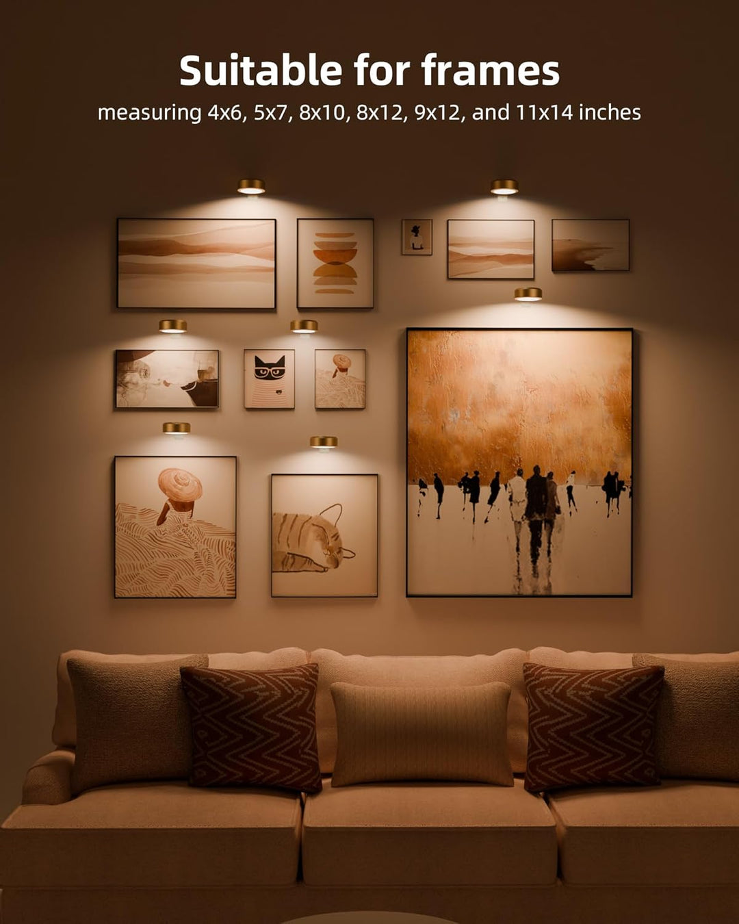 Several gold lights above a gallery wall of framed art in various sizes, set over a sofa with patterned cushions. 6
