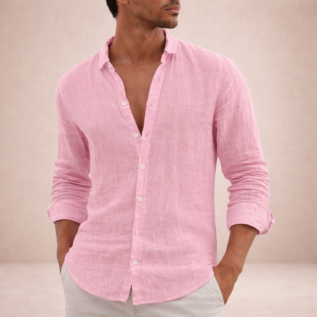 Model in the pink linen shirt with hands in light pants pockets, sleeves rolled.