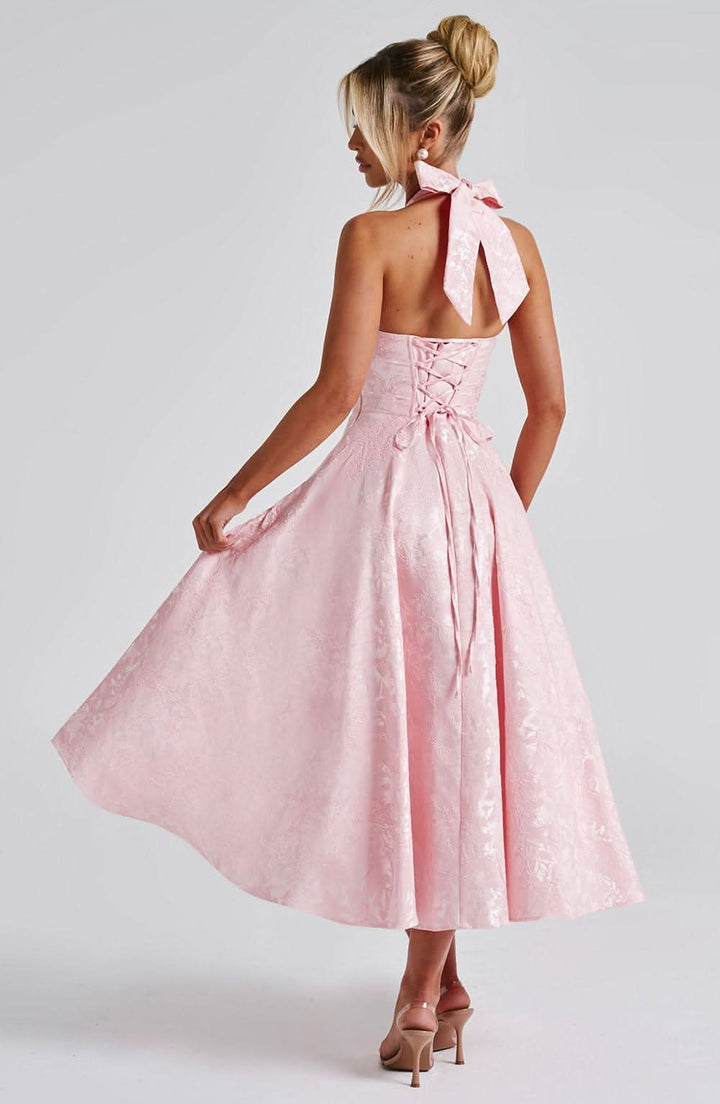 Red floral halter midi dress, back detail with open back and lace-up closure.