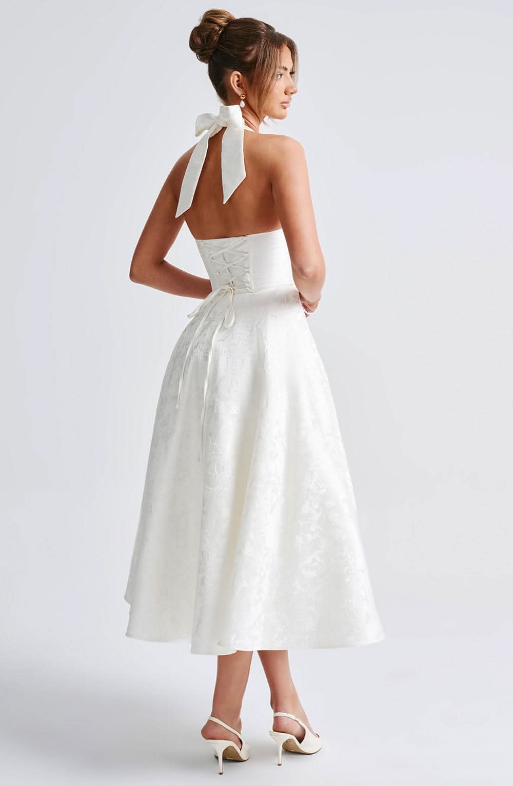 Red floral halter midi dress, back detail with open back and lace-up closure.