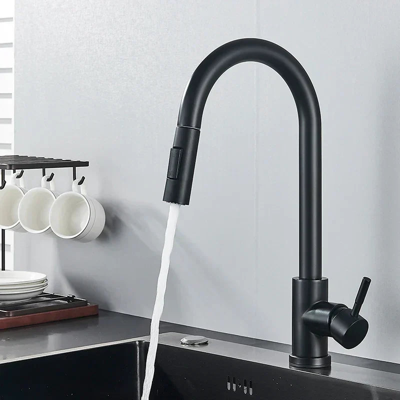 Matte black gooseneck faucet with side lever running water into a dark sink, mugs hanging beside it 5