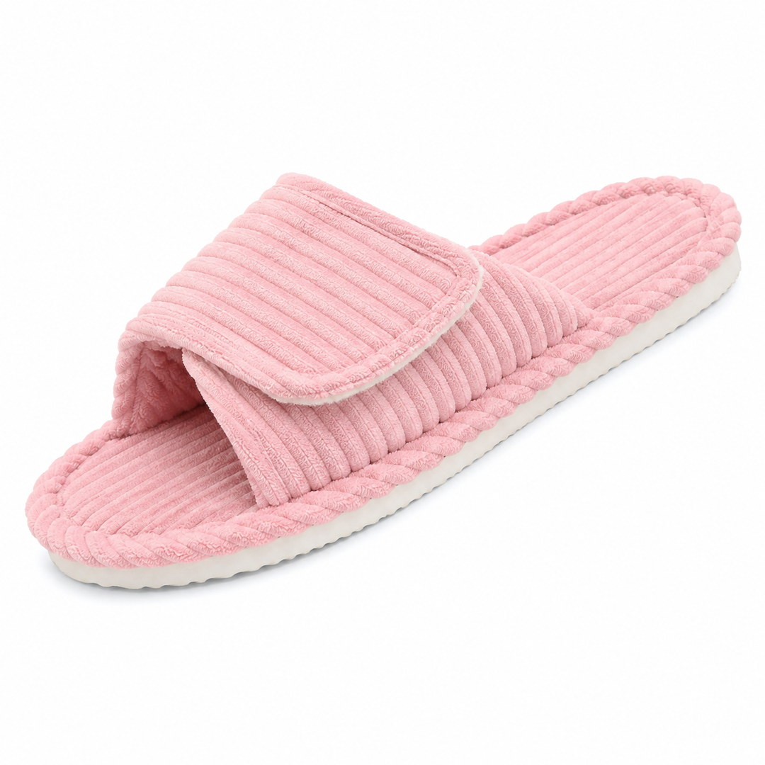 Pink corduroy open-toe slide slipper with an adjustable strap and a white sole, shown at an angle on a white background.