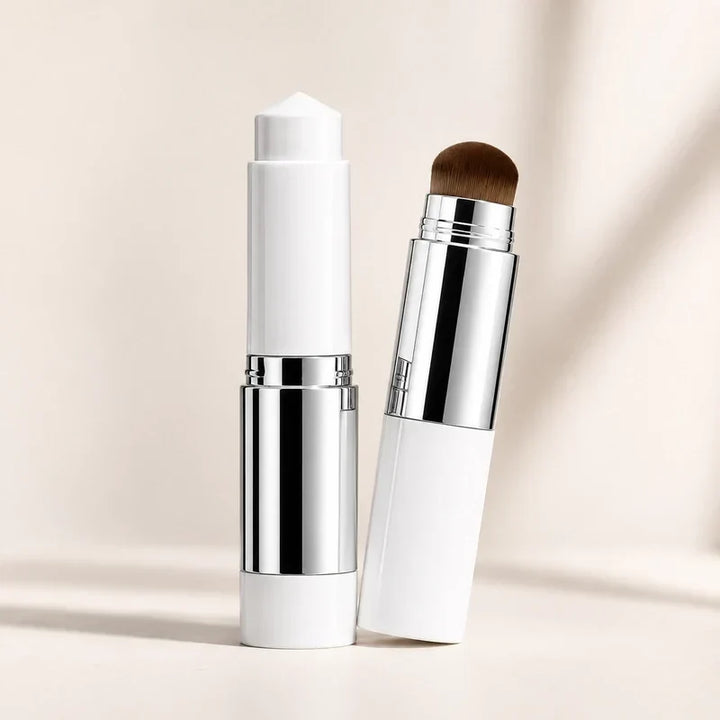 Color-Adjusting 2-in-1 Foundation two white sticks with silver bands, one showing the foundation tip and one the kabuki brush.