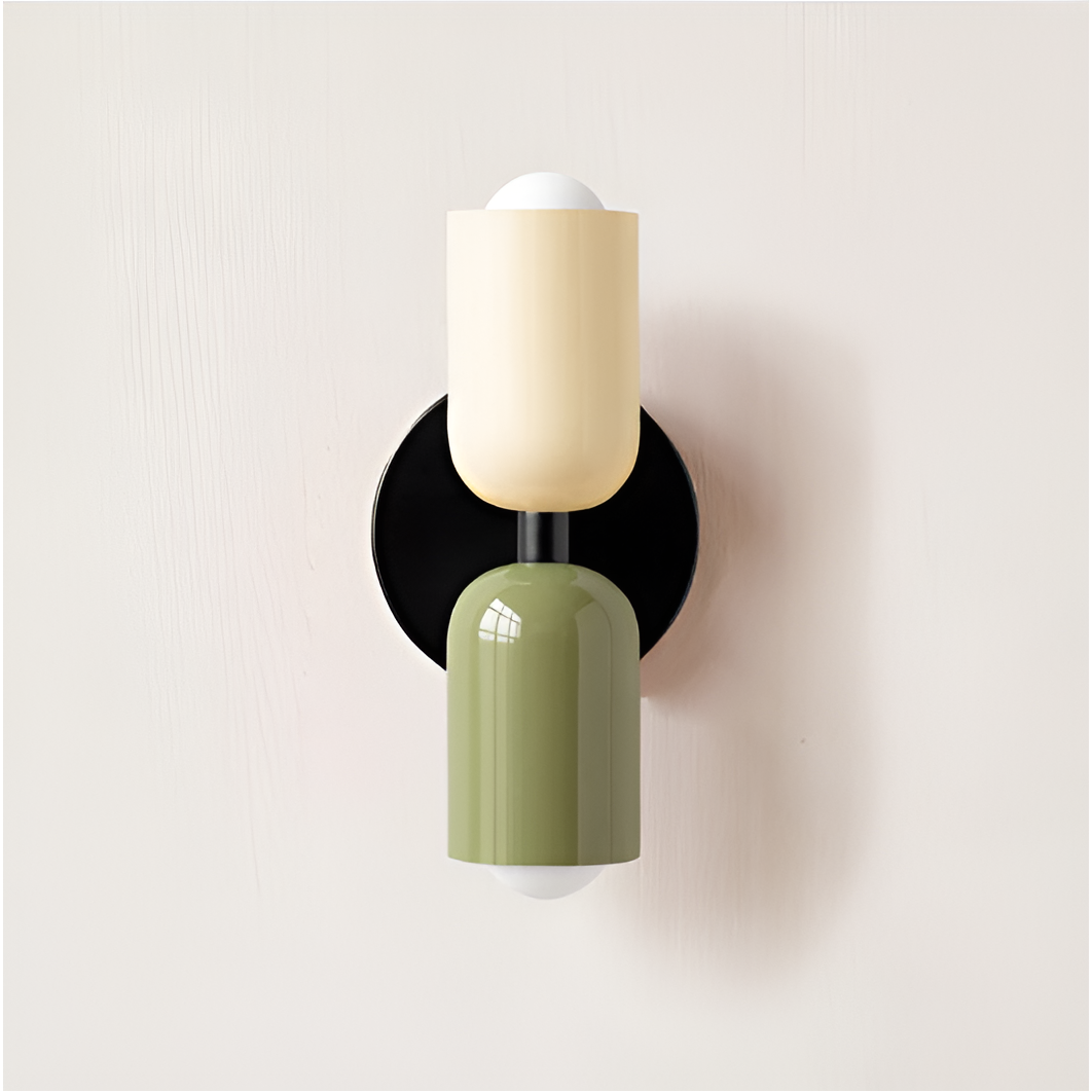 Wall light with a cream upper head and green lower head on a round black backplate. 32