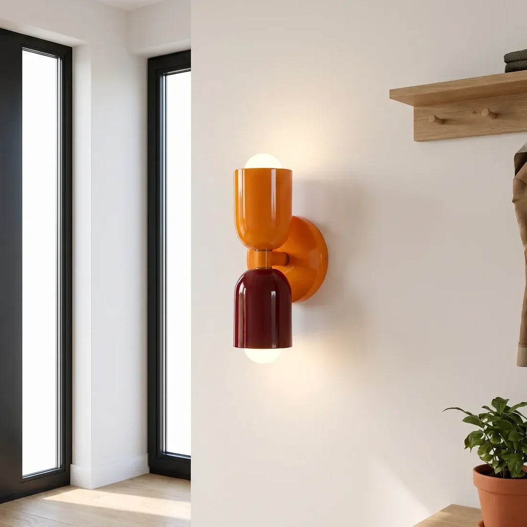 Retro wall lamp in glossy orange and burgundy in a bright entryway