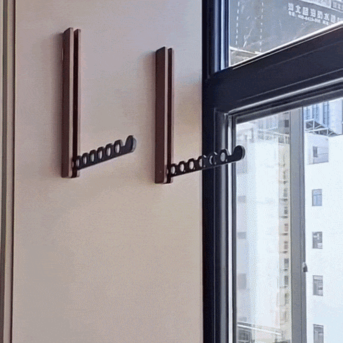 Foldable wooden wall coat rack detail with two mounted racks, one arm extended.