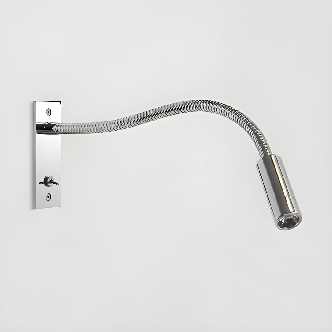 Polished chrome gooseneck wall light with shiny coiled arm and toggle switch on its wall plate against a light gray background.