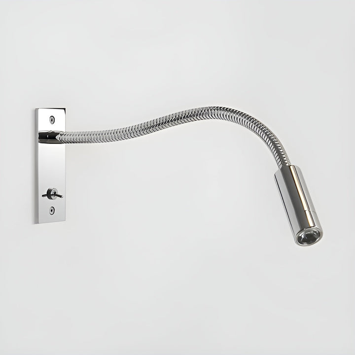Polished chrome gooseneck wall light with shiny coiled arm and toggle switch on its wall plate against a light gray background.
