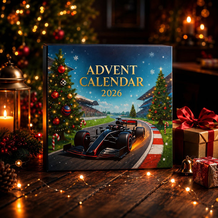 Race car advent calendar box on a dark wooden table with candles, fairy lights, pinecones and wrapped gifts.