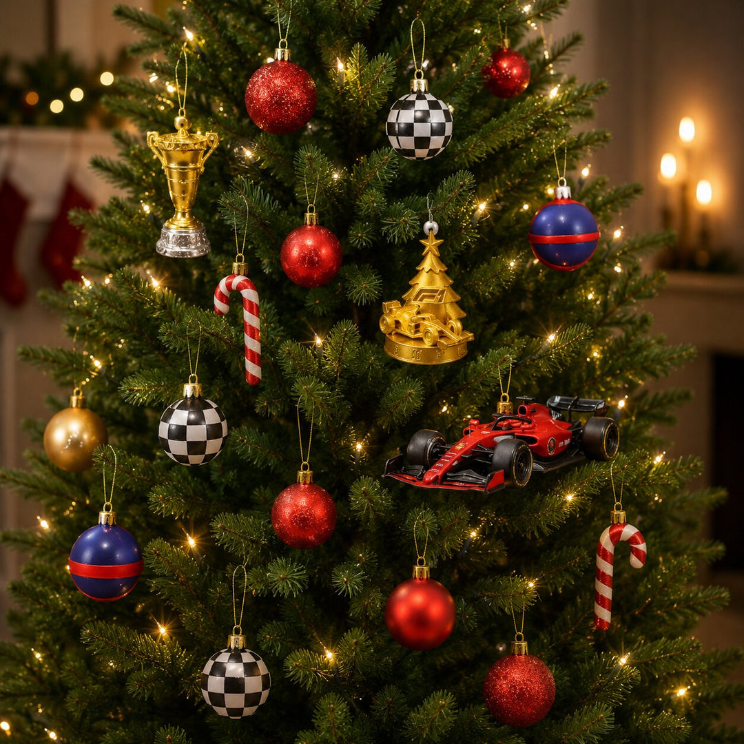 Christmas tree with checkered baubles, a gold trophy, a golden car-topped tree, candy canes and a red toy race car.