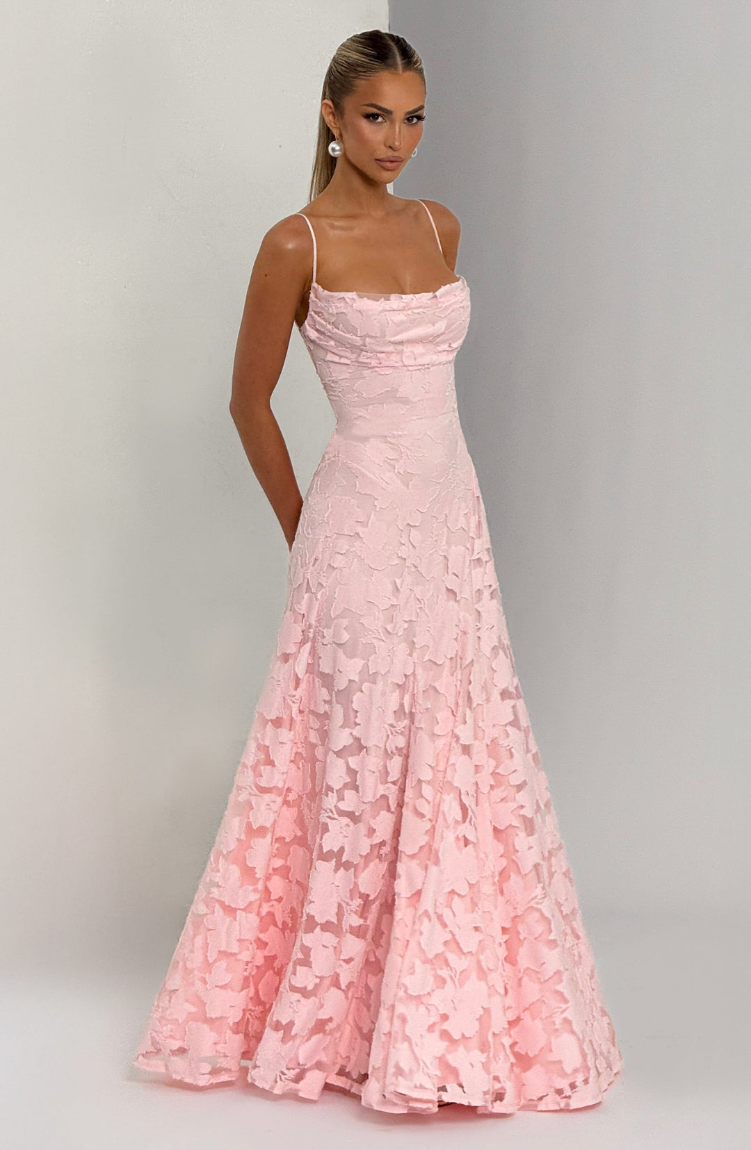 Elise Gingham Dress in light pink with a fitted bodice and flowing skirt, angled view.