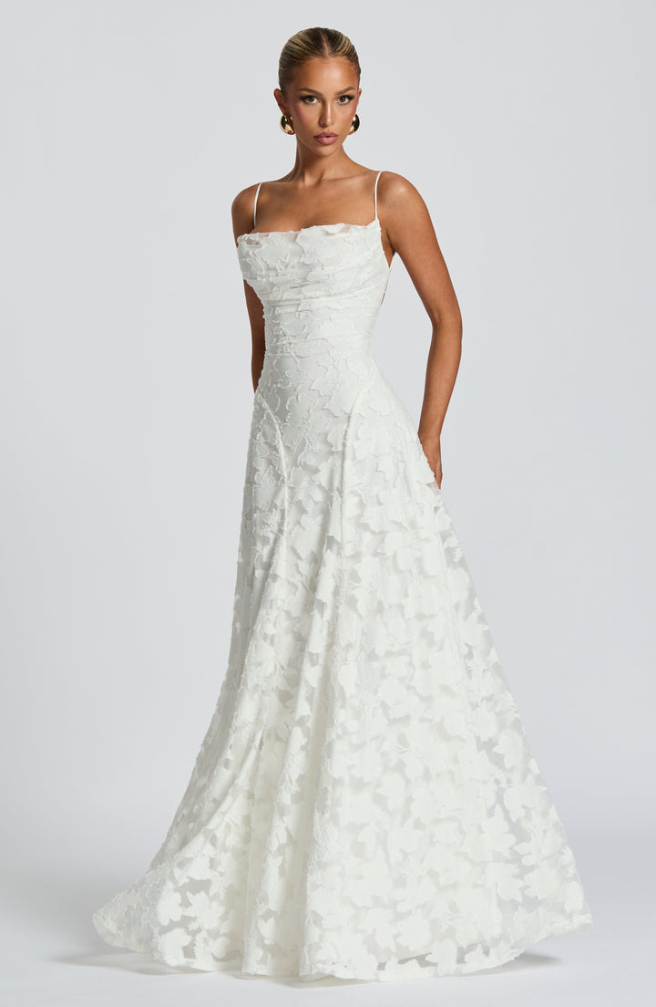Elise Gingham Dress in white with a flared full skirt and textured floral pattern, front angle view.