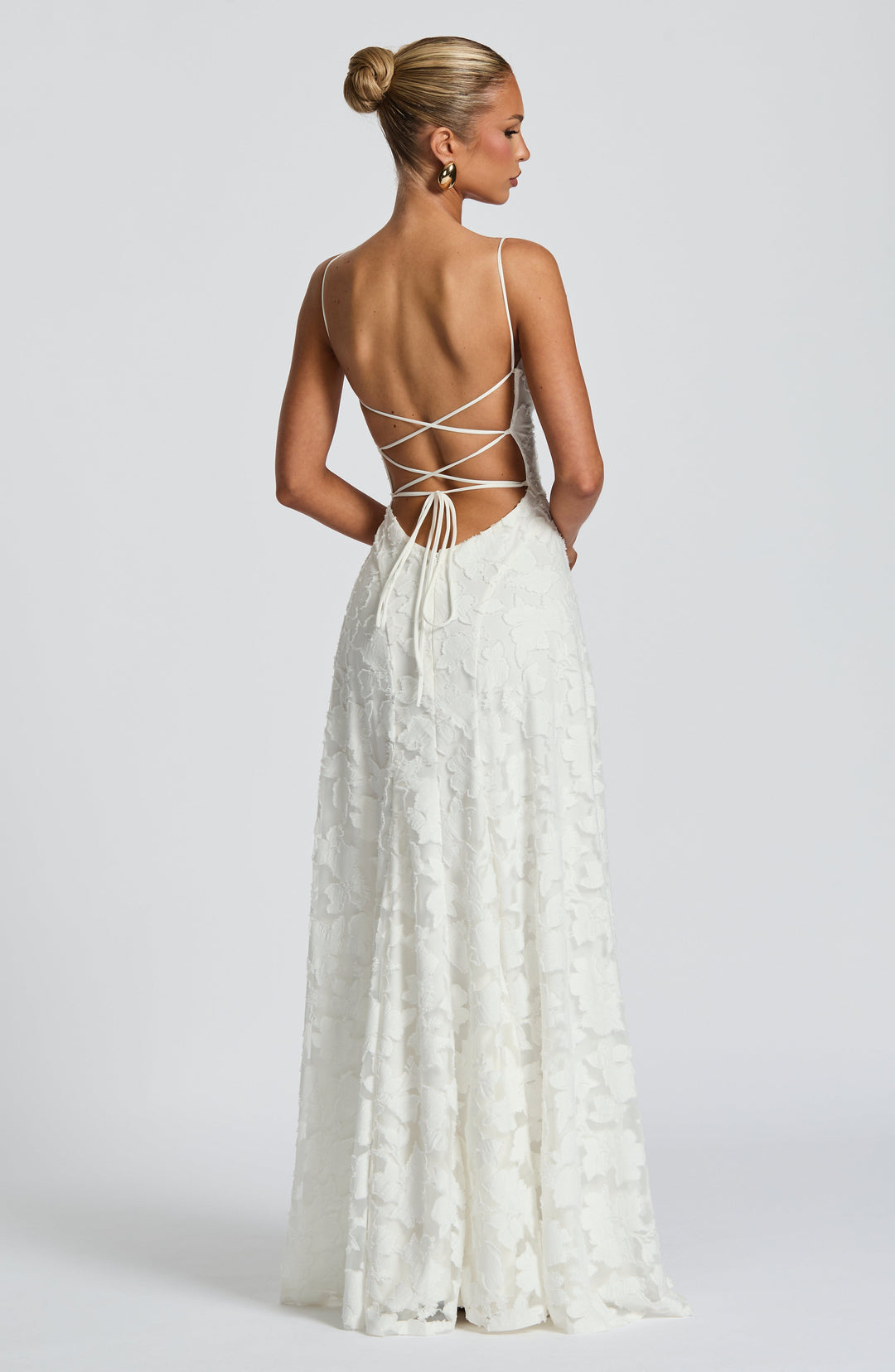 Elise Gingham Dress in white with an open back and crisscross lace-up ties, back view.