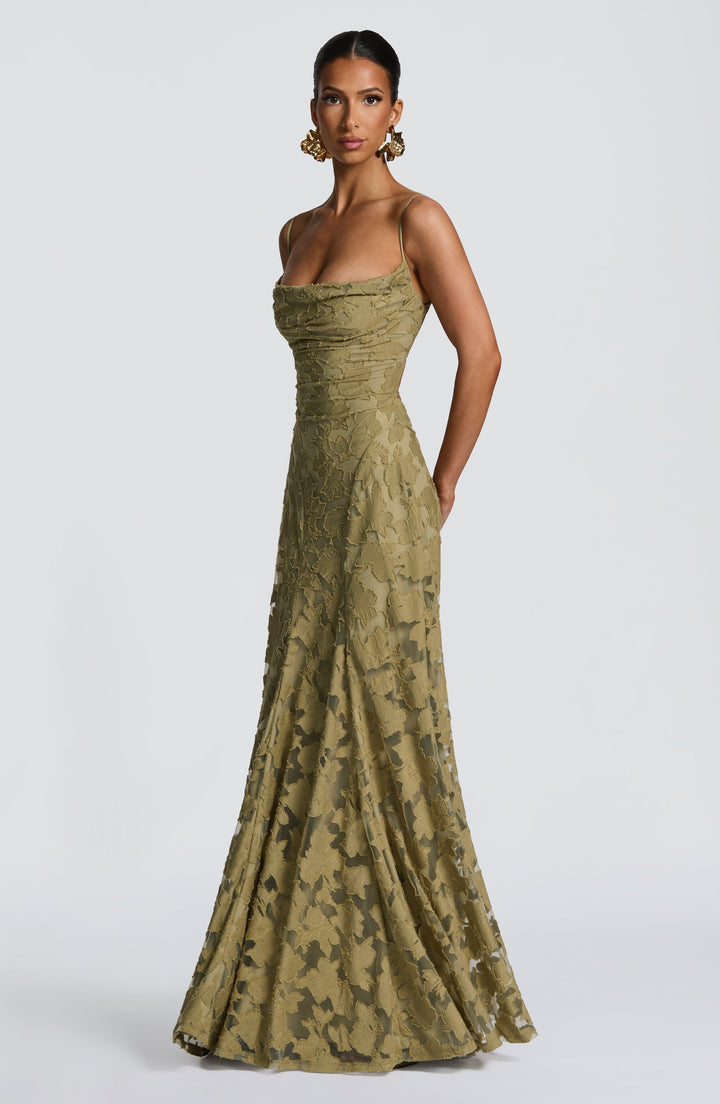 Angled front view of the olive green textured floral gown with a draped neckline and gently flared hem. 31