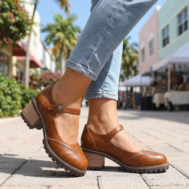 Brown pair worn on a sunny paved street, showing the buckle strap and wood-look block heel 5