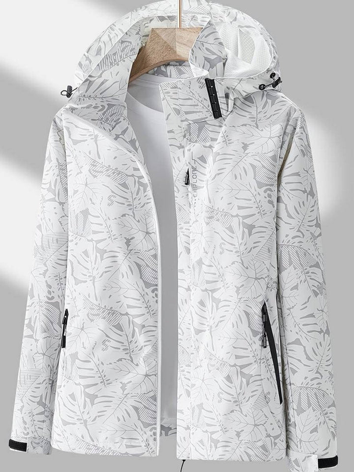 White and light gray leaf-print hooded jacket hanging open over a white top, with black zipper trim and adjustable hood toggles. 3