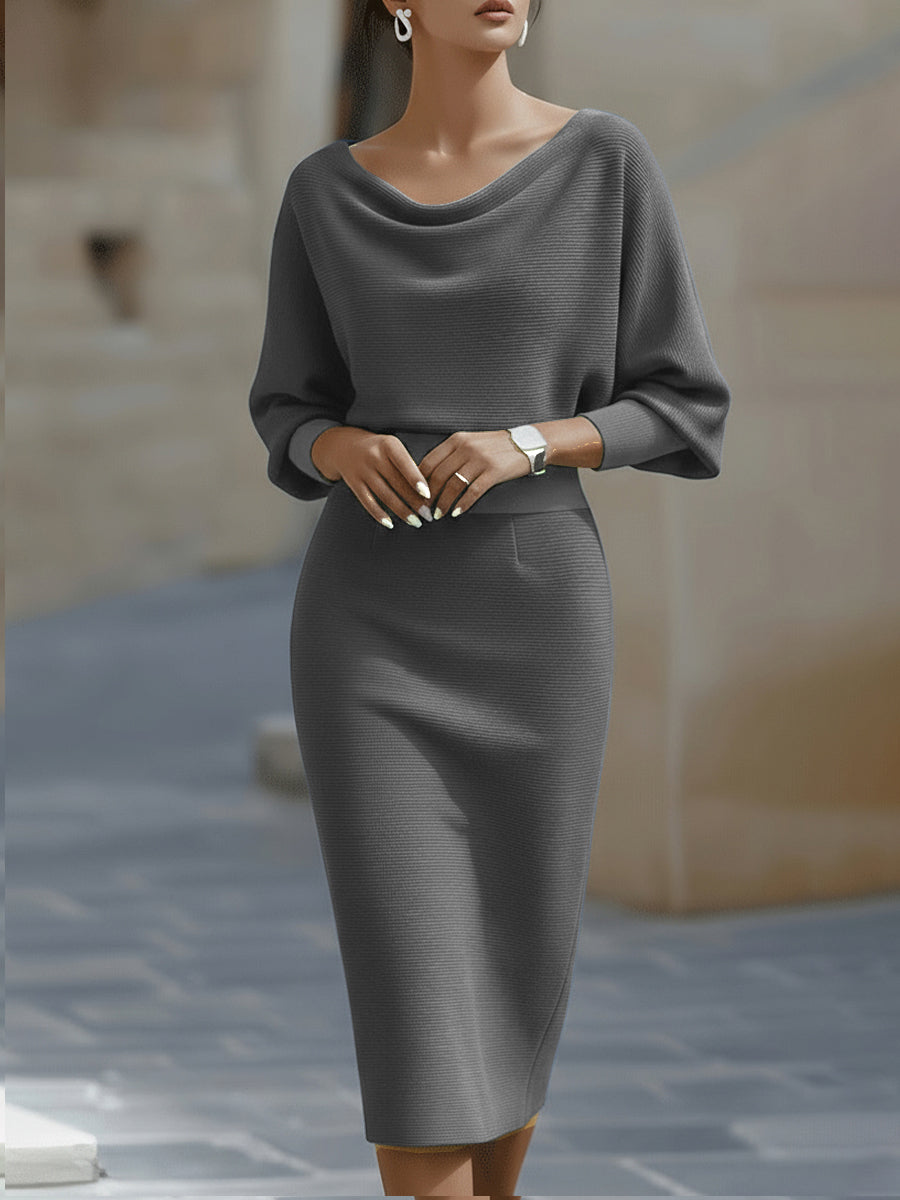 Model wearing the gray ribbed knit dress with draped neckline and fitted skirt, front view 5