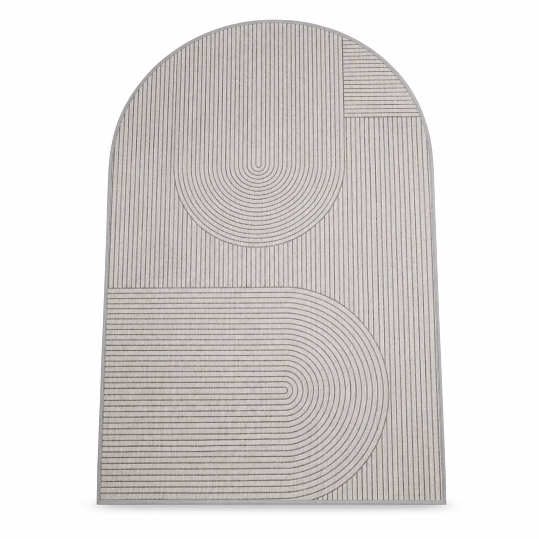Beige and grey arch-shaped polyester mat with a geometric pattern, seen from above.