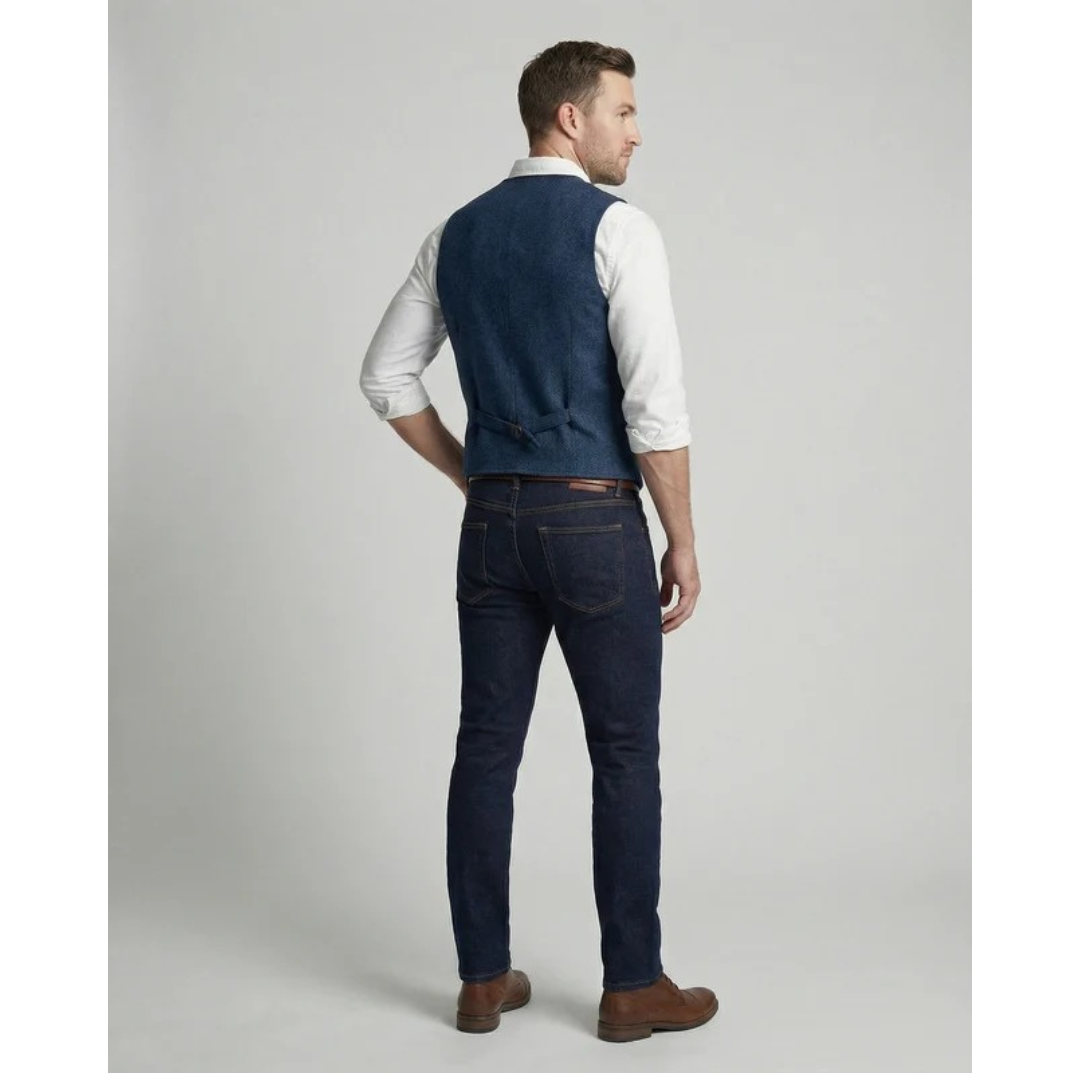 Blue vest back view showing the smooth back panel and adjustable buckle strap at the waist