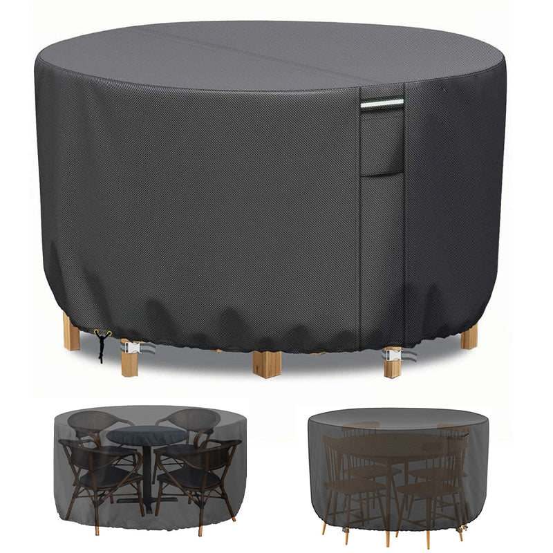 Dark gray round patio furniture cover another view with a front handle strap and dining sets underneath.