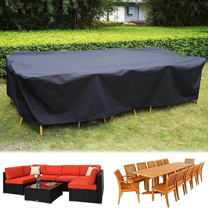 Black polyester patio furniture cover over an outdoor dining set.