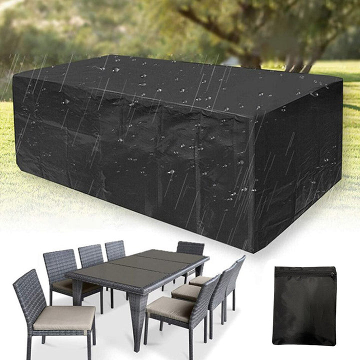 Black polyester patio furniture cover with rain beading on the surface.