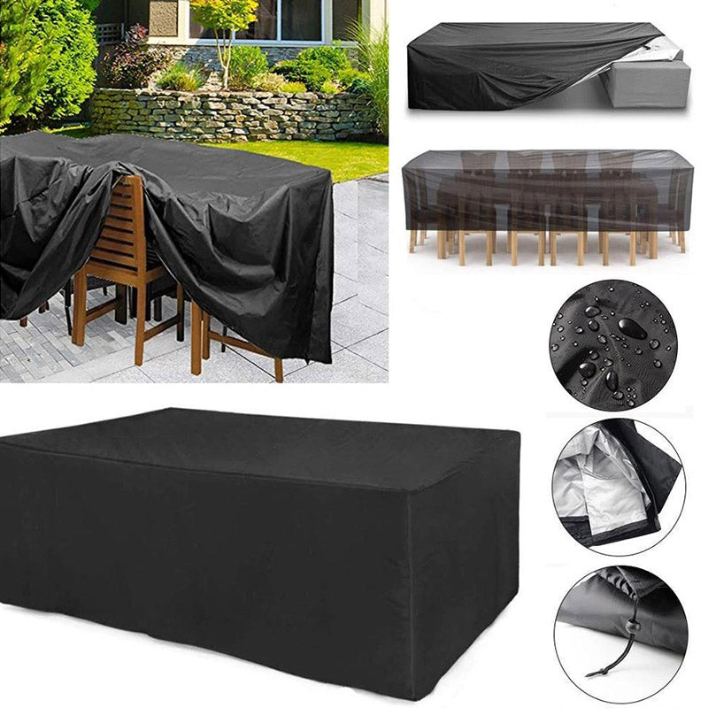 Black polyester patio furniture cover over a wooden dining set outdoors, with detail of water droplets and drawstring toggle.