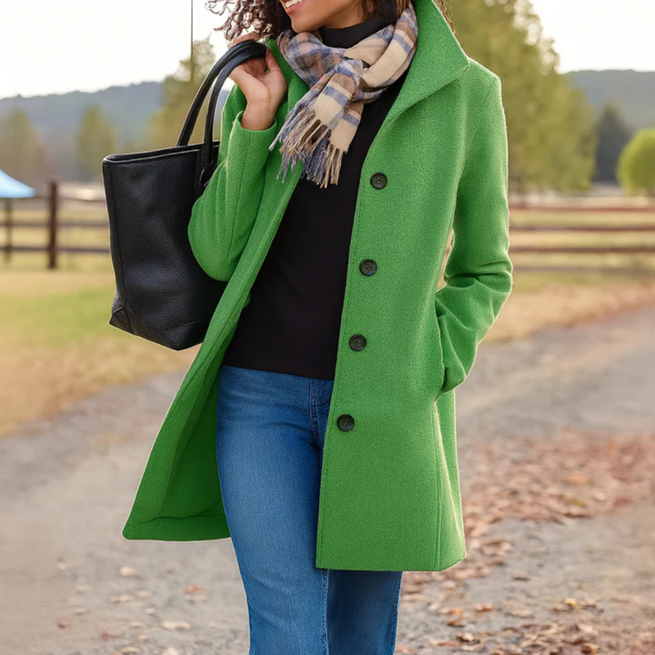 Heritage Button-Up Coat for Women in bright apple green with four dark buttons shown carrying a black tote.