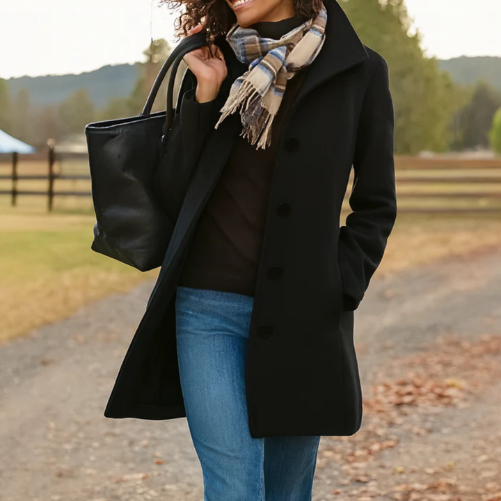 Heritage Button-Up Coat for Women in black shown outdoors.