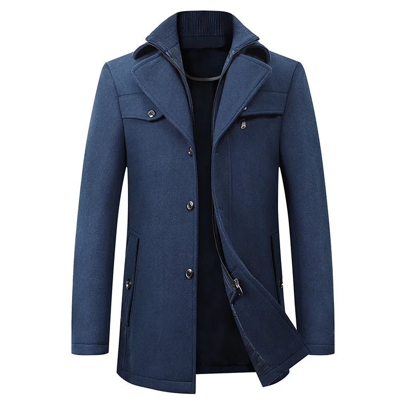 Front view of the blue version of the coat, showing the ribbed inner collar, button placket and zipper inner layer slightly open. 3