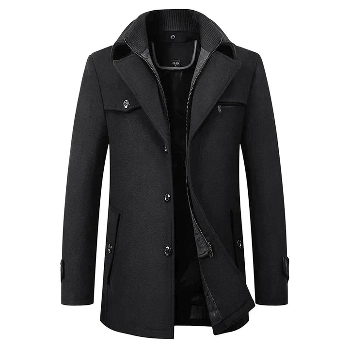 Front view of the black wool-blend peacoat with a layered knit collar, button front, chest zip pocket and open zip-through inner layer. 1