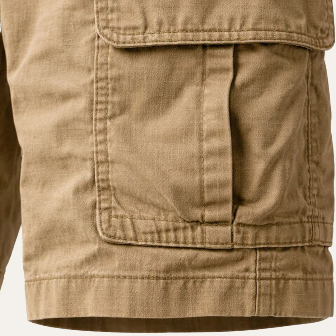 Detail of a flap pocket on the men's beige cargo shorts