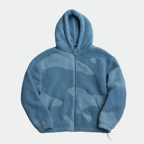 Front view of the zip-up fleece hoodie in two tones of blue with soft camouflage-like panels 3