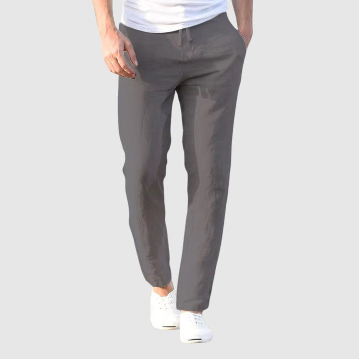 Men's grey drawstring pants, front view.