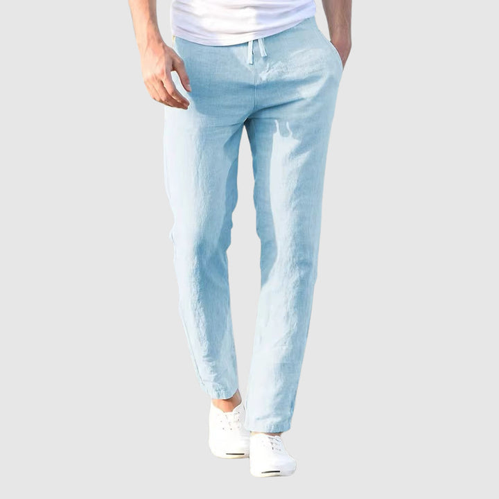 Men's light blue drawstring pants, front view.