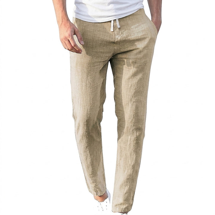 Men's beige linen pants with a white drawstring, shown close-up on a white background.