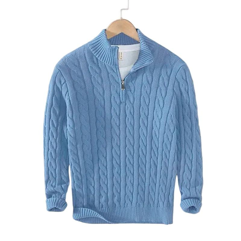 Light blue cable knit sweater with a short zip on a wooden hanger, white tee underneath 3