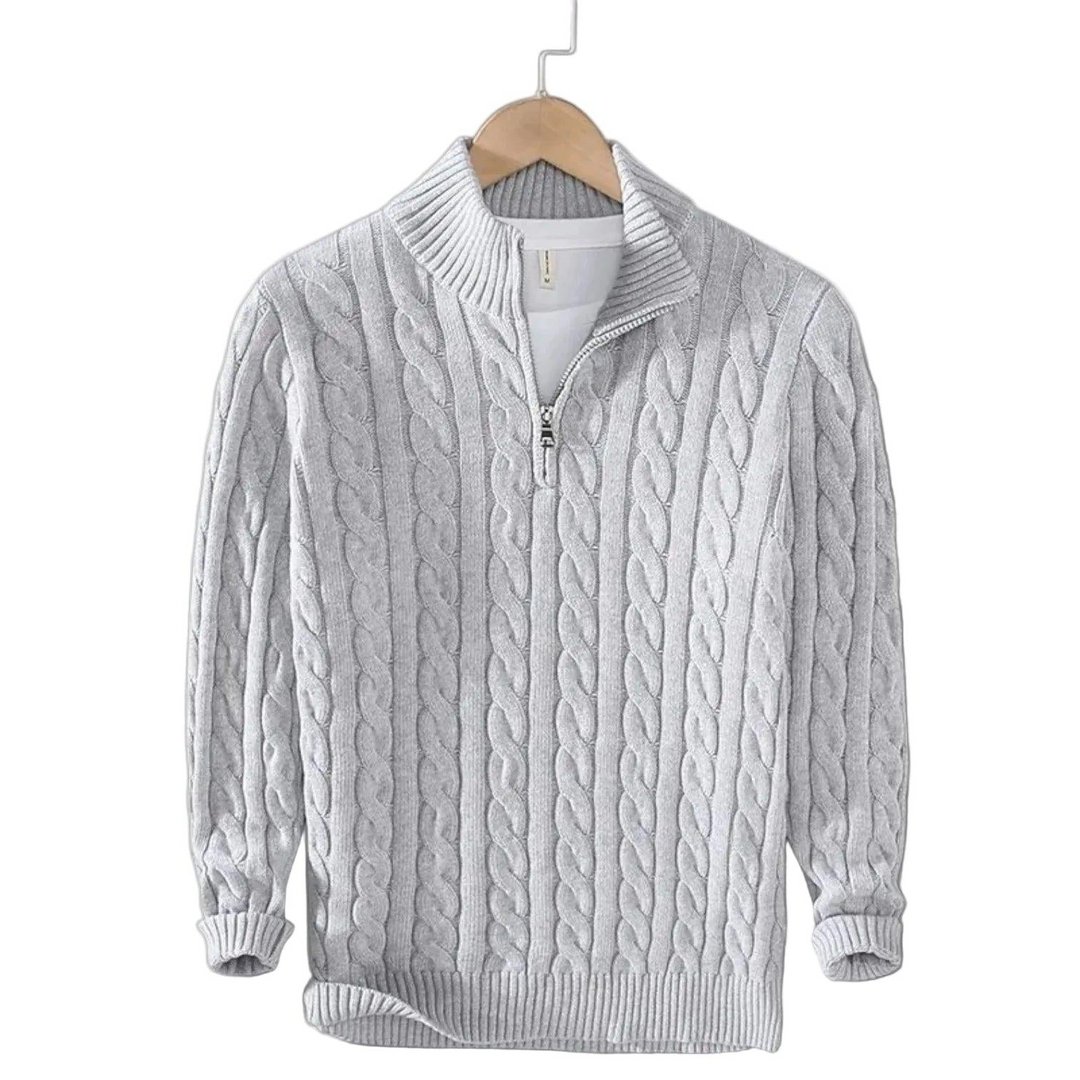 Light gray cable knit sweater with a short zip and ribbed collar on a wooden hanger 4