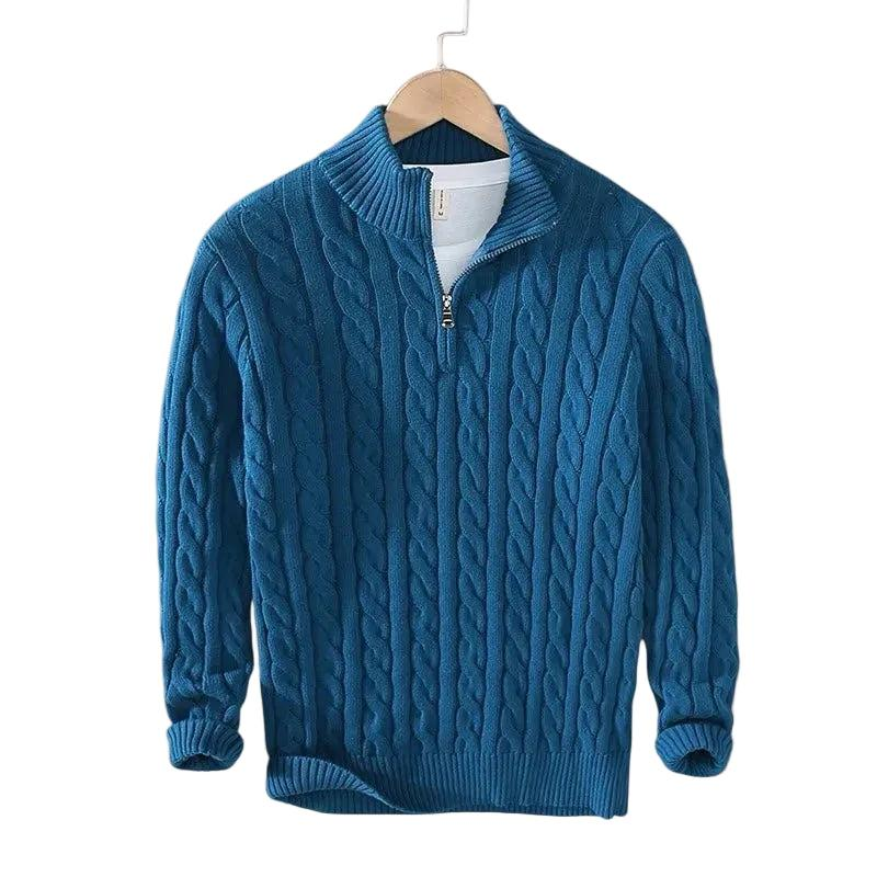 Deep teal blue cable knit sweater with a short zip hanging on a wooden hanger 5