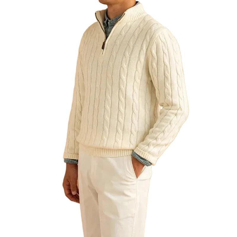 Man wearing the cream cable knit sweater with white pants and a blue shirt underneath 1