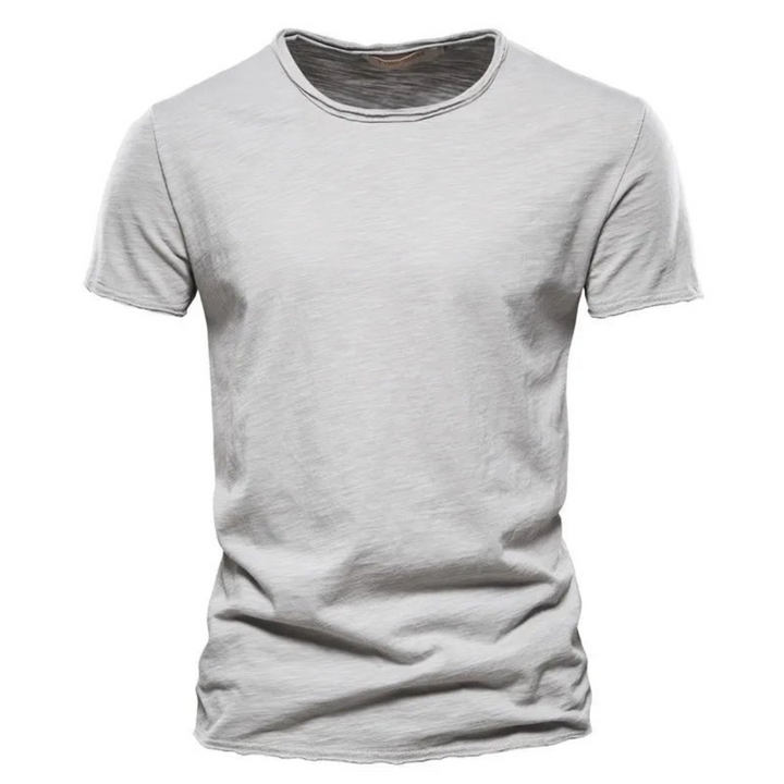 Men's short-sleeve crew neck tee in light gray with subtle slub texture and raw-edge neckline.